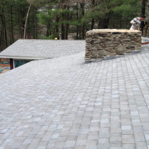 grey asphalt roof that would benefit from regular roof maintenance